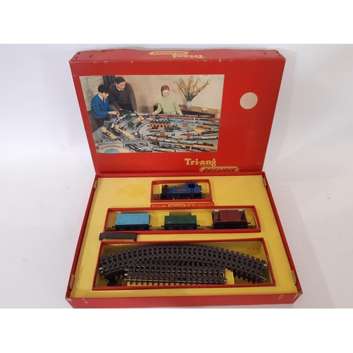 885 - A large collection of 00 gauge railway models by Triang comprising 1960's RS24 'Pick Up' boxed goods... 