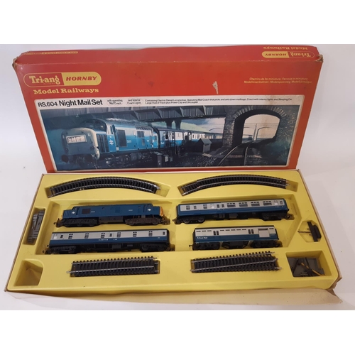 885 - A large collection of 00 gauge railway models by Triang comprising 1960's RS24 'Pick Up' boxed goods... 