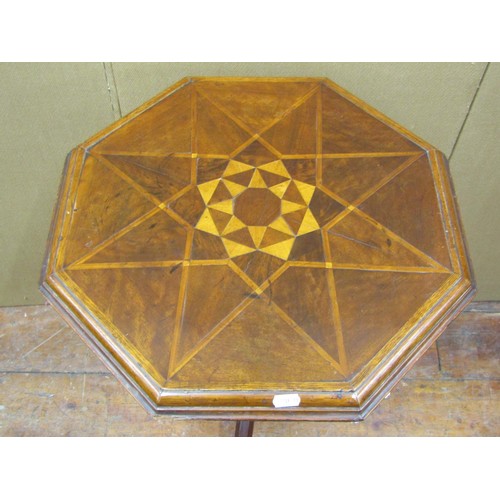 1359 - A Victorian walnut occasional table, the octagonal top with inlaid marquetry detail, raised on a cha... 