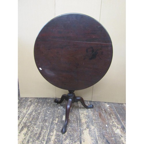 1393 - A Georgian mahogany tripod table raised on a turned pillar with birdcage action, 75cm diameter