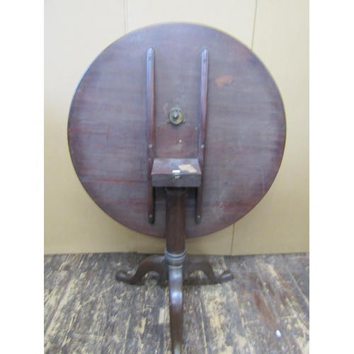 1420 - A Georgian mahogany snaptop table, the 83cm diameter top raised on a simple gun barrel pillar and tr... 