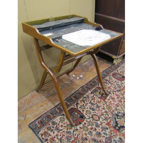 1426 - A Victorian oak campaign desk with folding action, with fitted interior on shaped supports