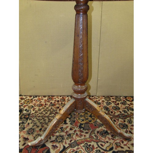 1350 - An ebonised torchere 88cm high together with a 19th century sandalwood occasional table with carved ... 