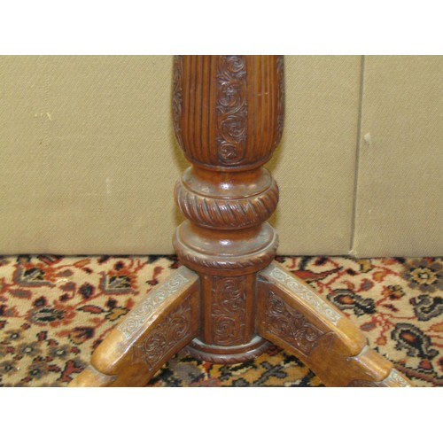 1350 - An ebonised torchere 88cm high together with a 19th century sandalwood occasional table with carved ... 