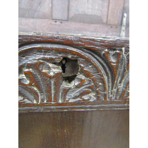 1416 - Early 18th century oak panelled coffer with carved and moulded frieze work, 240 cm wide