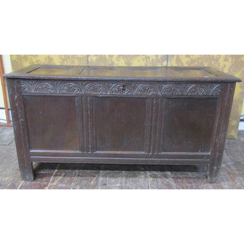 1416 - Early 18th century oak panelled coffer with carved and moulded frieze work, 240 cm wide