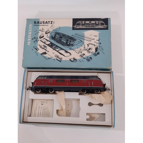 894 - A collection of HO gauge Marklin train sets and models including boxed sets 2967 and 3100, boxed rol... 