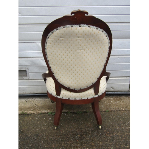 1451 - A Victorian mahogany spoon back chair with upholstered finish