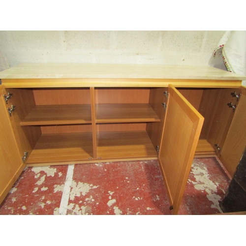 1463 - A contemporary side cupboard in beechwood with travertine stone top and door panels, 190cm x 53cm