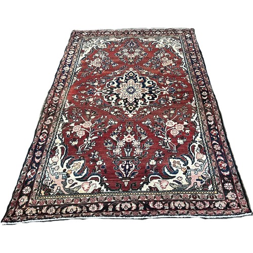 1527 - North West Persian Sarouk Mahal Rug, with a central floral medallion with clusters of flowers on a d... 