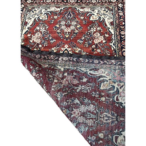 1527 - North West Persian Sarouk Mahal Rug, with a central floral medallion with clusters of flowers on a d... 