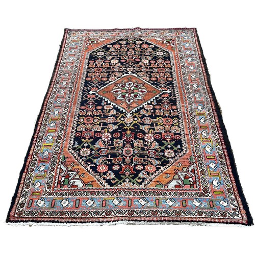 1523 - North West Persian Malayer Rug, with a pink diamond centre decorated with flowers surrounded by a fi... 