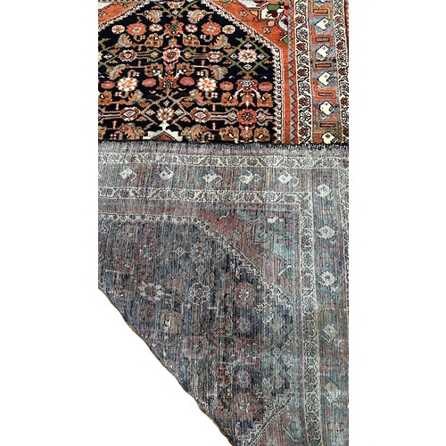 1523 - North West Persian Malayer Rug, with a pink diamond centre decorated with flowers surrounded by a fi... 