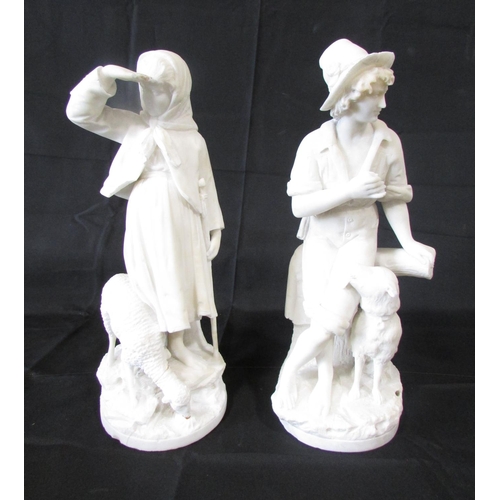 558 - A pair white alabaster figures of a shepherd boy with his dog and a Shepherd girl with a sheep, both... 