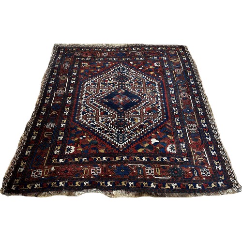 1482 - An old tribal Qashgai Persian rug with a central medallion with stylised flowers , 190 x 156cm appro... 