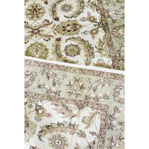 1485 - A Zeigler design carpet with an all over floral and frond pattern on a cream ground, 250cm x 170cm a... 