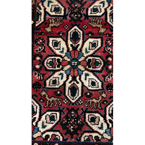 1487 - A small Iranian Hosseinabad rug with a central petal medallion 90cm x 63cm approximately