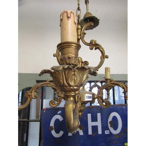 1006 - A good quality cast brass five branch candelabra with scrolling detail, 68cm diameter approx, 50cm h... 