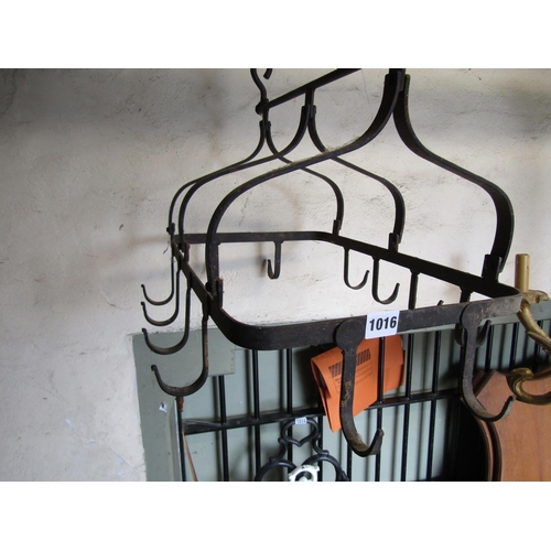 1016 - A vintage iron pot rack bearing twelve hooks with chain support 55cm long x 42cm wide approx