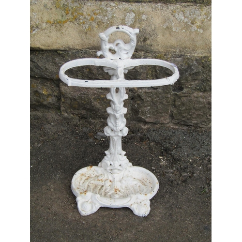 1018 - Two cast iron stick stands both with decorative finish