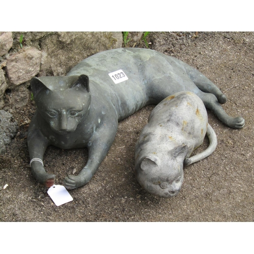 1023 - Two cast metal reclining cats
