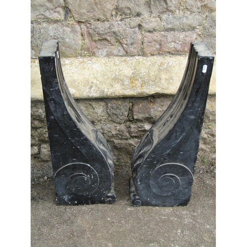 1030 - A pair of Regency black marble scrolling bosses, with acanthus detail, 60cm high