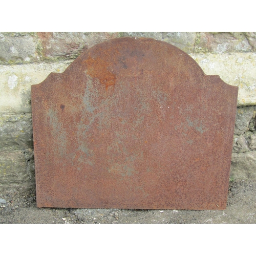 1036 - An old cast iron fire back with C scroll and other detail, 55cm high x 60cm wide