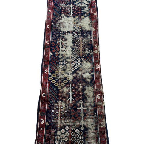 1488 - Two pieces of old North West Persian Runners, with an all over stylised floral pattern on a blue gro... 