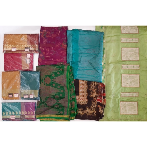 907 - 5 Indian saris by Krishna Sarees, unused in original packaging, together with 5 colourful silk saris... 