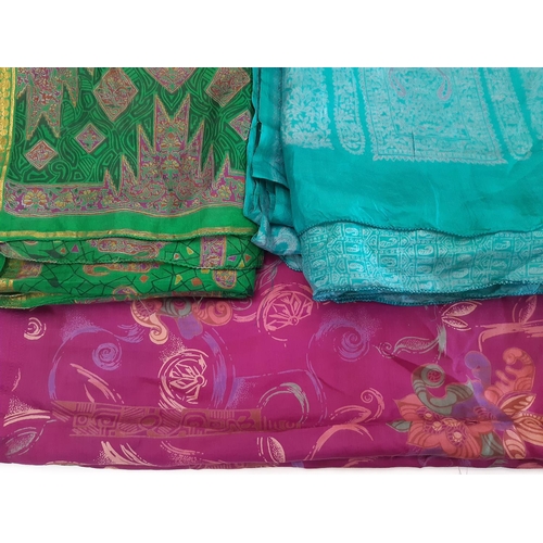 907 - 5 Indian saris by Krishna Sarees, unused in original packaging, together with 5 colourful silk saris... 