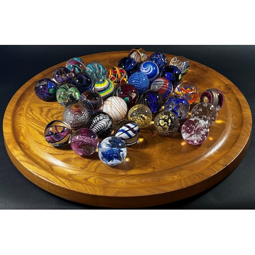 108 - A “House of Marbles” type 60 cm diameter wooden Solitaire Board with a complete set of marbles toget... 