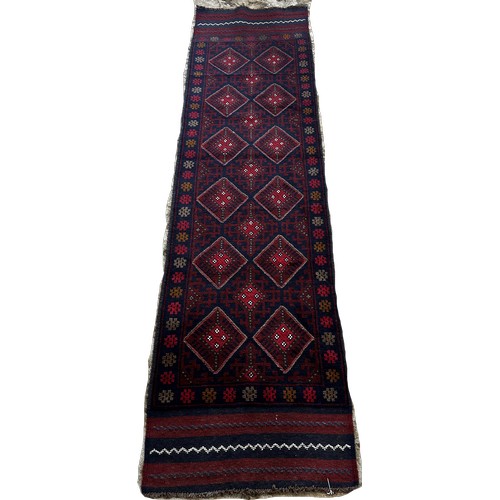 1483 - A Meswani runner with a red and blue all over diamond pattern 229 x 60 approximately