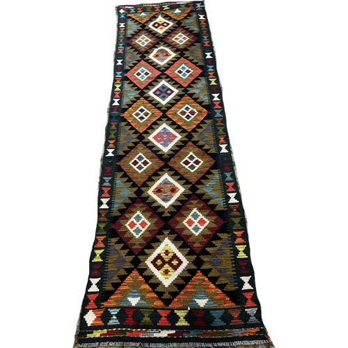 1532 - A Maimana kilim runner with staggered stepped diamonds on a dark field,  292 x76cm approximately