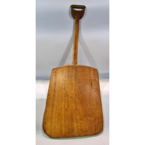 579 - A Vintage brewer’s wooden malt shovel, 101cm long