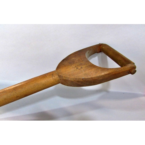 579 - A Vintage brewer’s wooden malt shovel, 101cm long