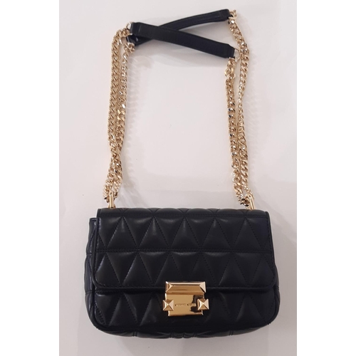 909 - 3 designer ladies hand bags comprising a small  crossbody bag by Michael Kors in quilted black leath... 