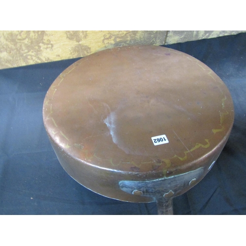 1062 - An outsized copper saucepan with iron handle, 48cm diameter