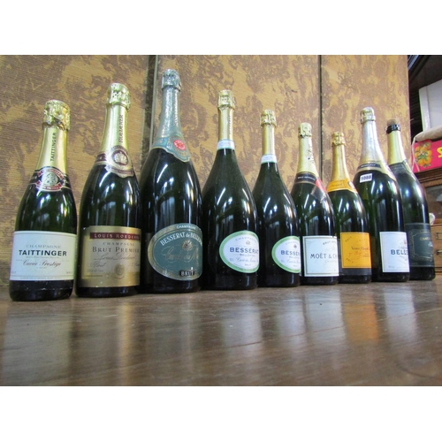 1088 - Nine empty champagne and other bottles with labels for decoration