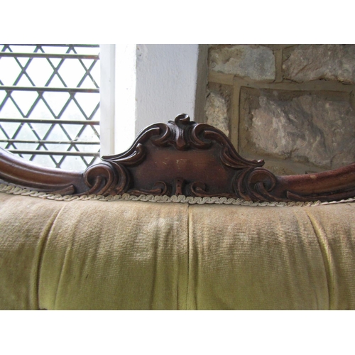 1093 - A Victorian mahogany framed parlour room sofa, with shaped outline and upholstered finish,