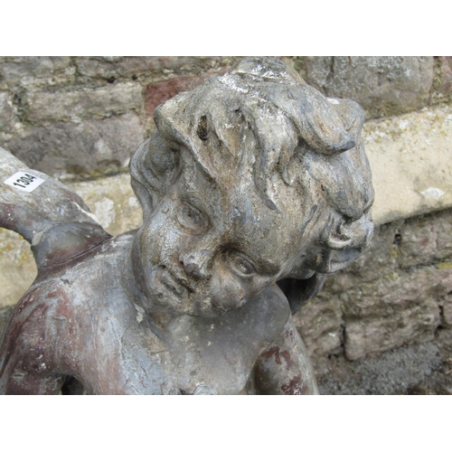 1304 - A 19th century lead water fountain in the form of a winged cherub clasping a fish, 80cm high