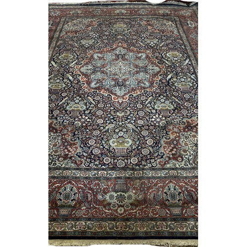 1513 - A large Fine Persian cotton and silk carpet  with a central floral medallion and with all over flora... 