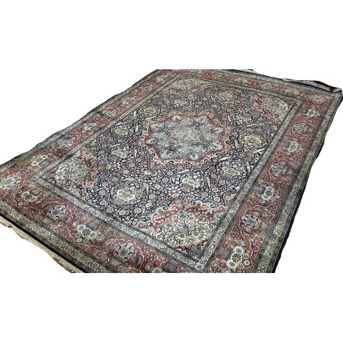 1513 - A large Fine Persian cotton and silk carpet  with a central floral medallion and with all over flora... 