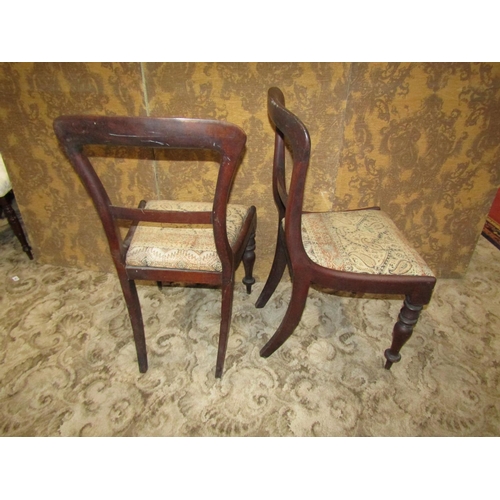 1100 - A set of six Victorian mahogany dining chairs on turned legs