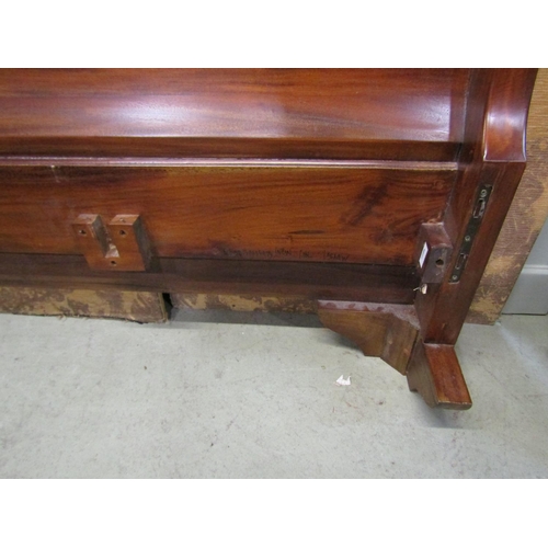 1258 - A mahogany sleigh bed frame of usual form to accept a 5ft mattress