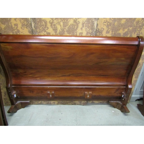 1258 - A mahogany sleigh bed frame of usual form to accept a 5ft mattress