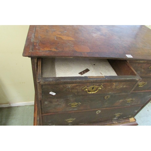 1437 - A Georgian walnut chest on stand of three long and two short graduated drawers, the stand enclosing ... 