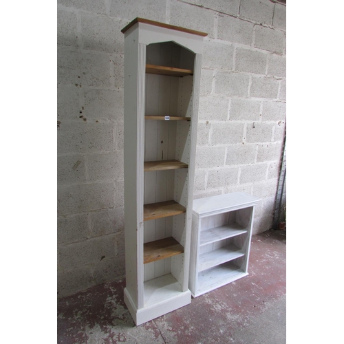 1446 - A tall narrow upright bookcase enclosing adjustable shelves within a painted and reeded framework 21... 