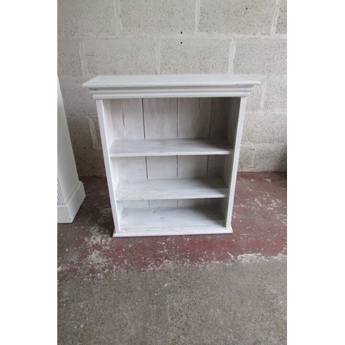 1446 - A tall narrow upright bookcase enclosing adjustable shelves within a painted and reeded framework 21... 