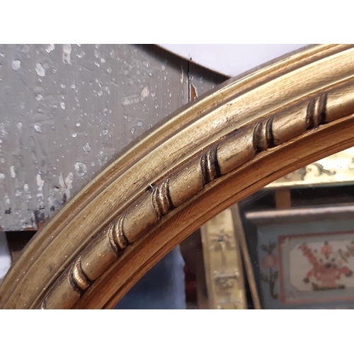 1294 - A Victorian style arched overmantle mirror, with repeating detail, 115cm high x 115cm wide