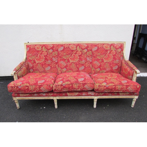 1453 - A French drawing room suite comprising a three seat sofa and four matching tub chairs, the frames wi... 